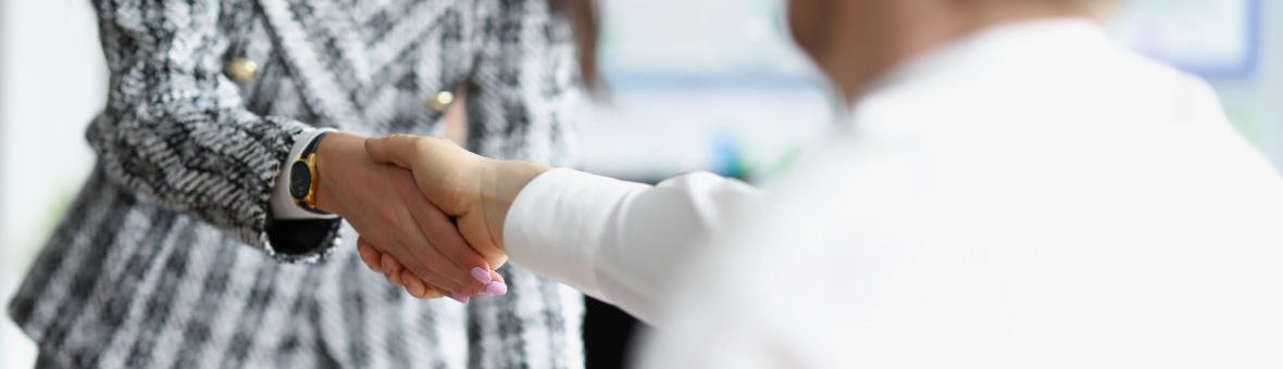 Closeup of handshake of business man and woman in meeting Closeup of handshake of business man and woman in meeting. Business partnership concept